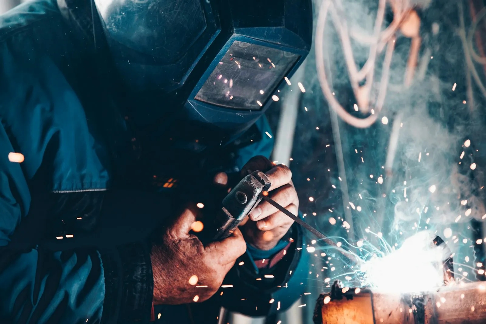 Welder fabricating steel